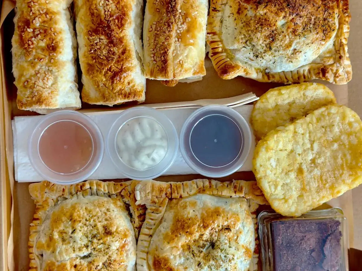 Hungry Squirrel Family Brunch Box with sausage rolls, spanakopita, hash browns, sauces and a brownie